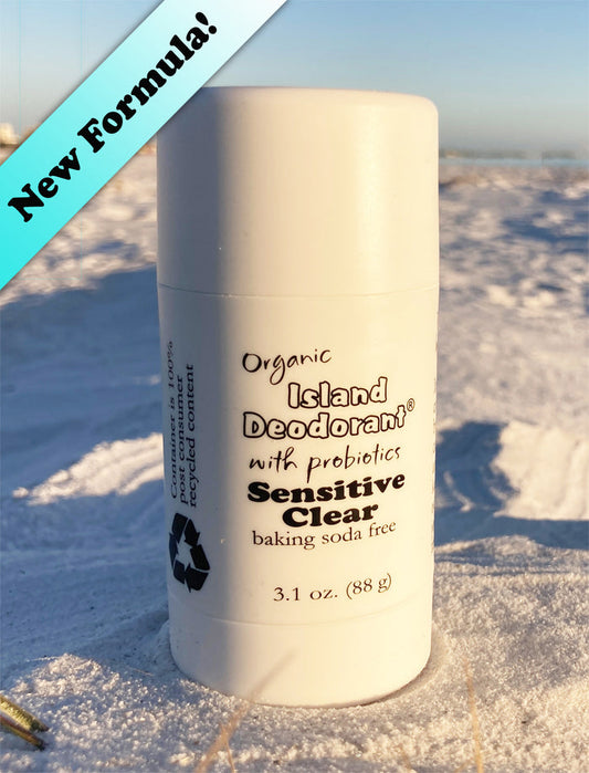 Organic Island Deodorant Sensitive Clear magnesium deodorant with zinc ricinoleate on beach with new formula banner