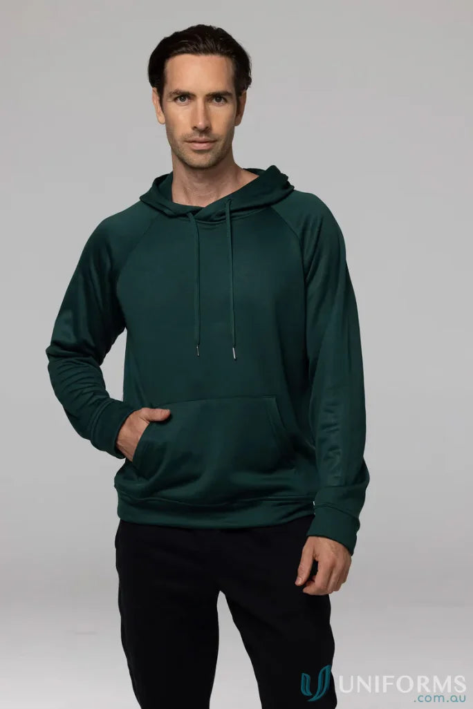 Man in a green Crusader Fleece Hoodie and black pants showing comfortable fit