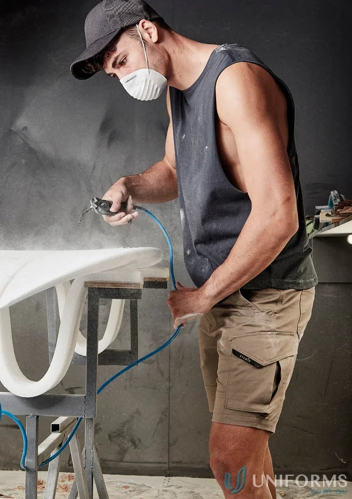 Man spray-painting surfboard wearing Mens Streetworx Sleeveless Tee with drop armholes