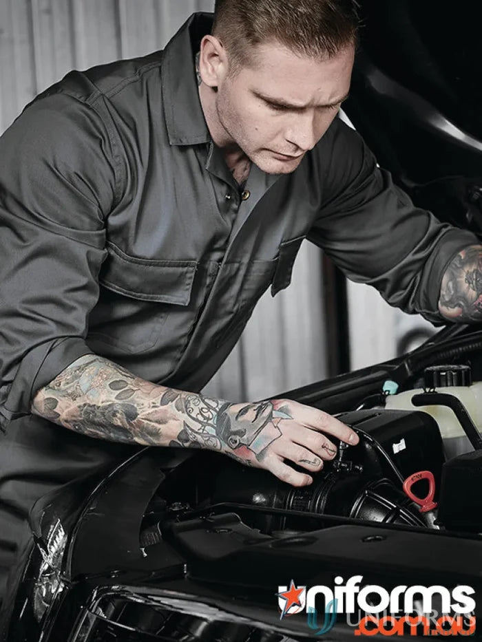 Gray mechanic jumpsuit from Syzmic Range Men’s with hip pockets and pen partition